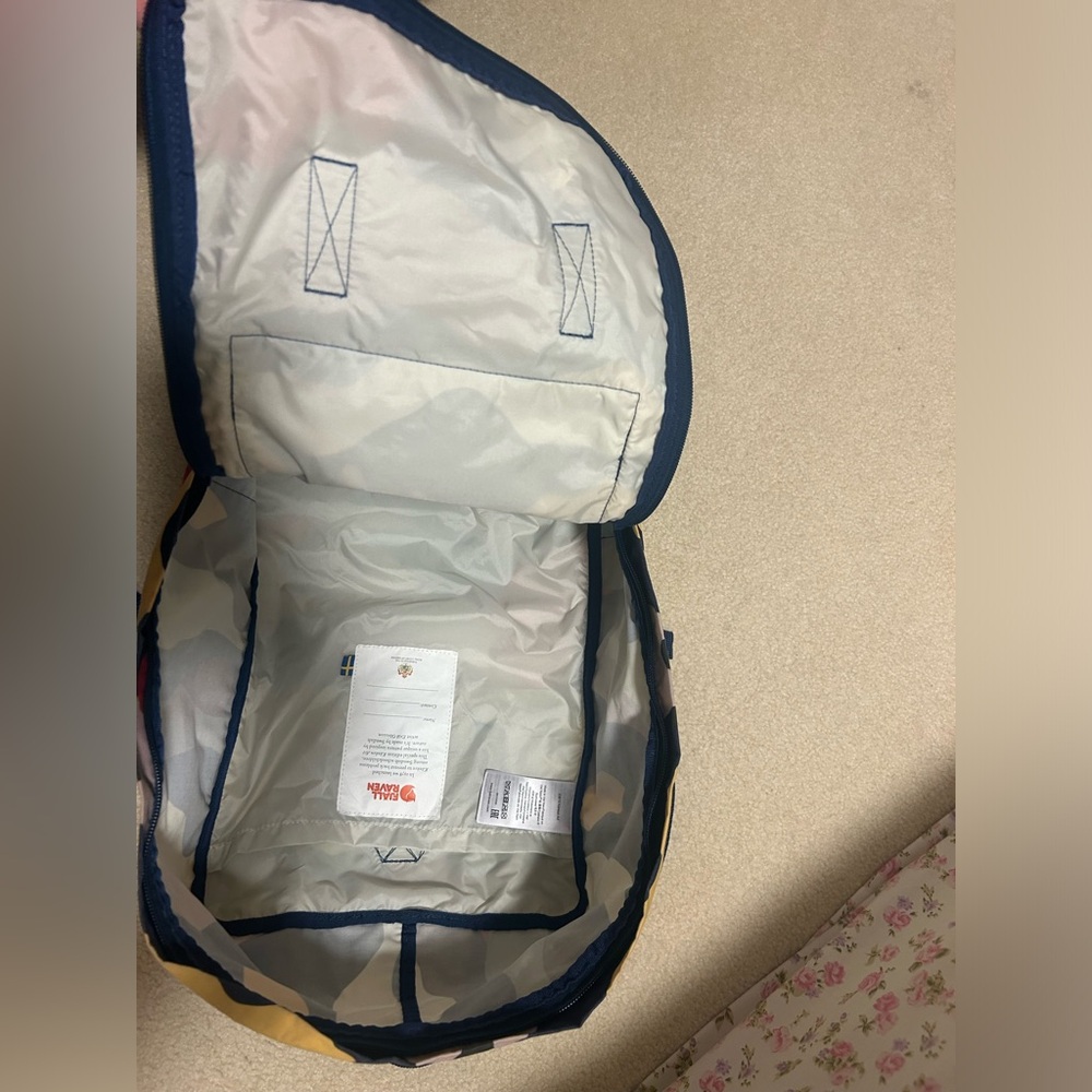 Unused Fjallraven Kanken rainbow camo backpack. Summer landscape